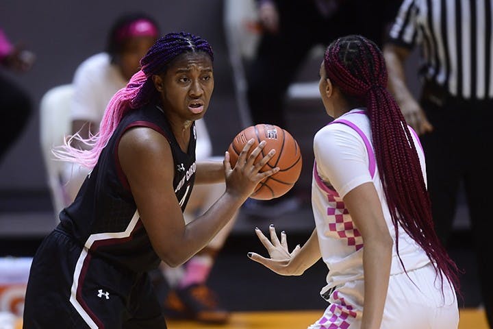 Sophomore forward Aliyah Boston holds the ball while facing a Tennessee player.