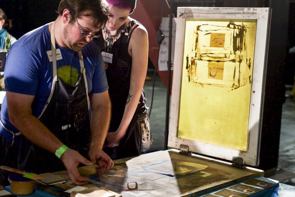 Arts and Draughts showcased art, local restaurants and live music in spite of heavy downpours, drawing a&nbsp;large crowd.