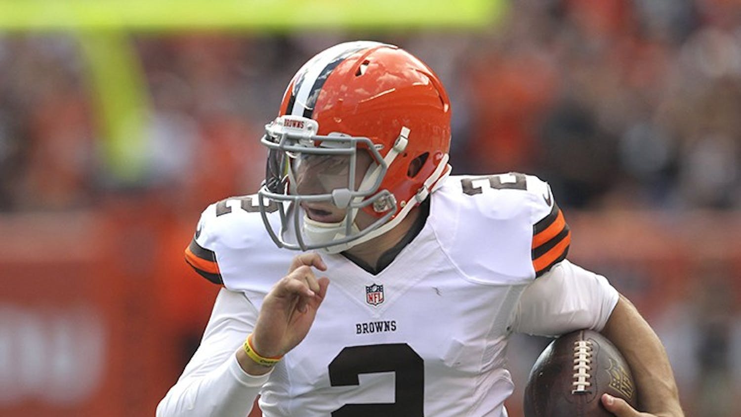 Cleveland Browns back-up quarterback Johnny Manziel runs for 39 yards after a pass catch against the Baltimore Ravens hat was nullified by a penalty on Sunday, Sept. 21, 2014, at FirstEnergy Stadium in Cleveland. (Phil Masturzo/Akron Beacon Journal/MCT)