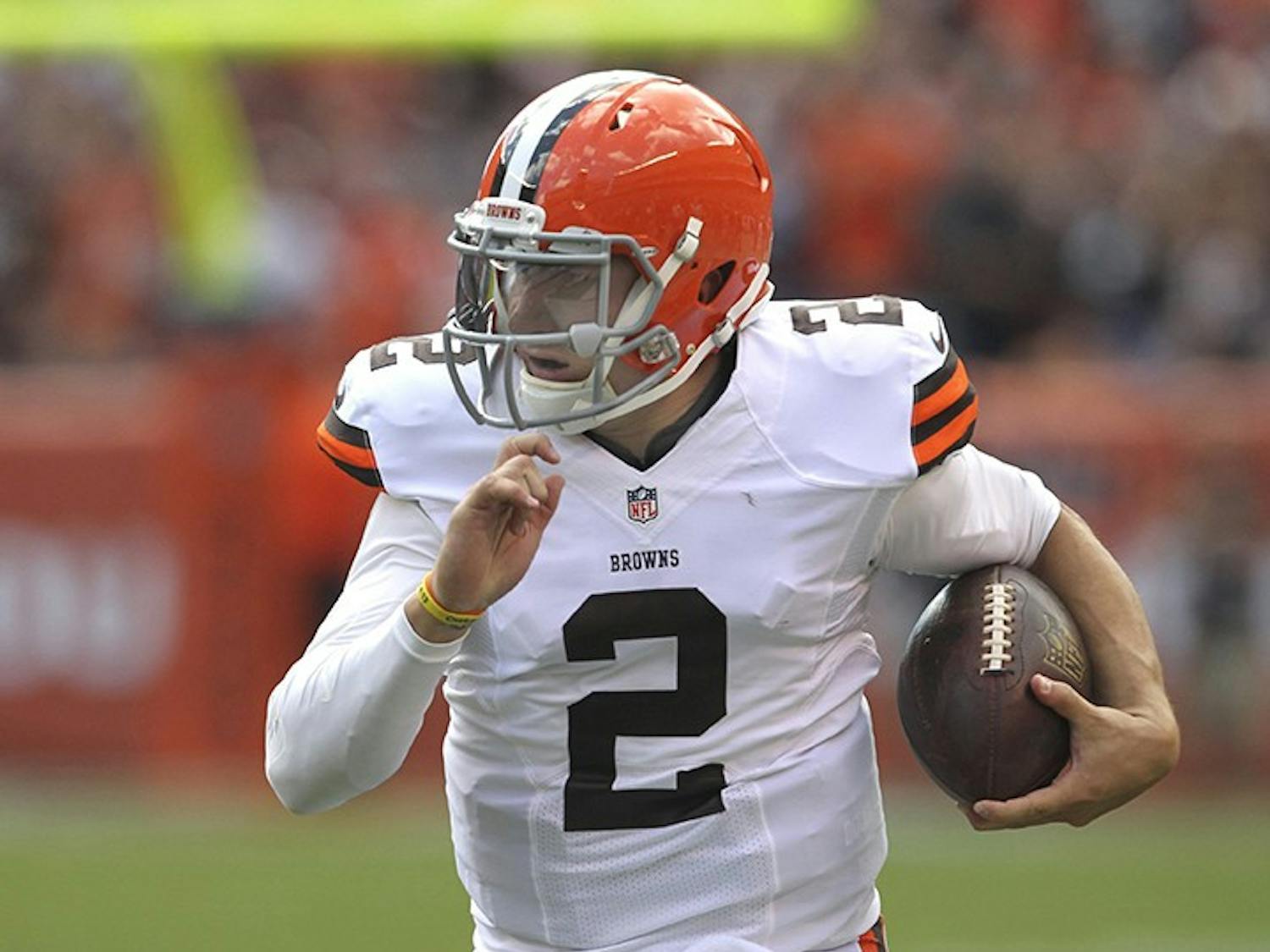 Cleveland Browns back-up quarterback Johnny Manziel runs for 39 yards after a pass catch against the Baltimore Ravens hat was nullified by a penalty on Sunday, Sept. 21, 2014, at FirstEnergy Stadium in Cleveland. (Phil Masturzo/Akron Beacon Journal/MCT)