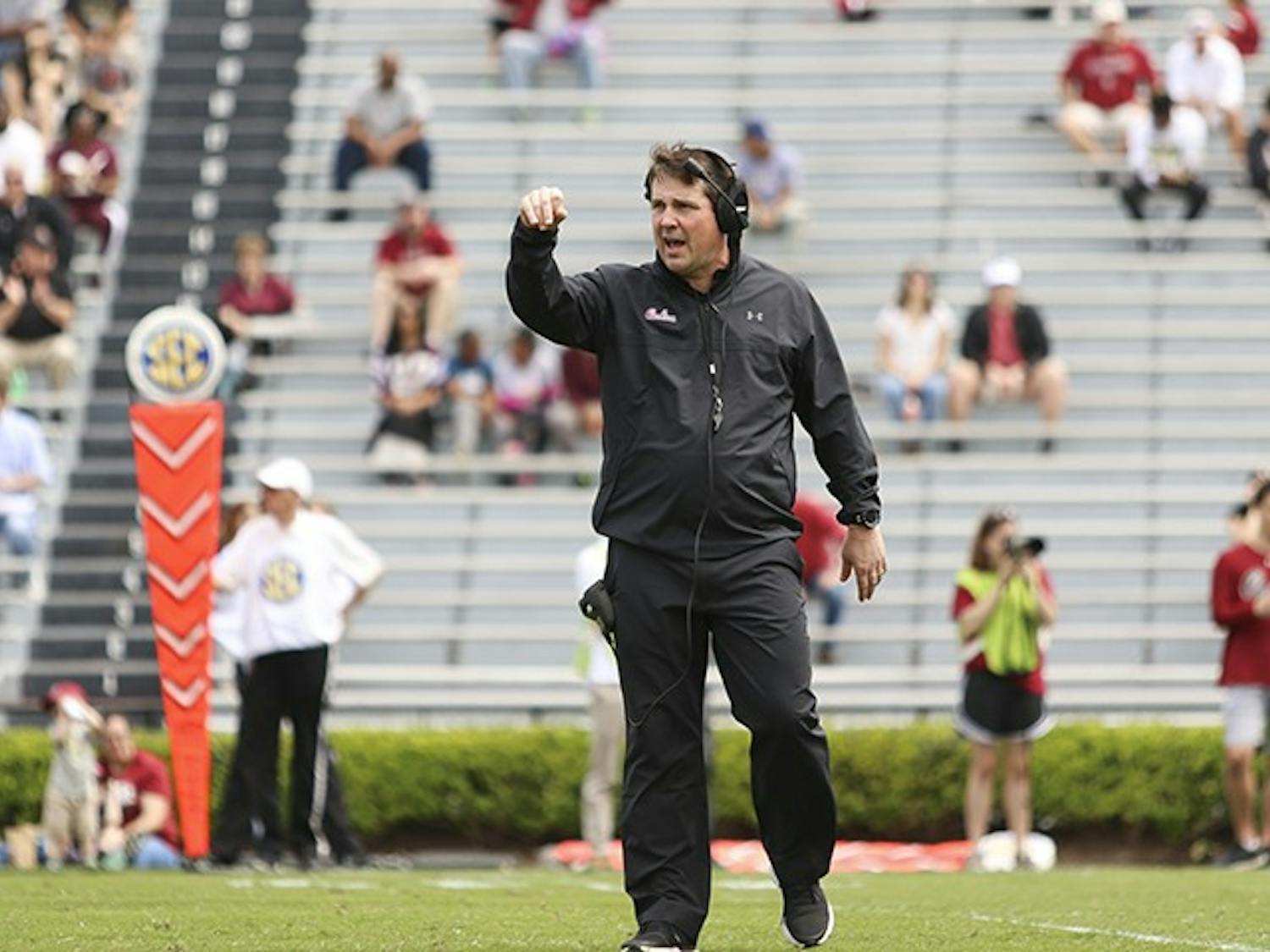 Head coach Will Muschamp yells down the field during the Garnet and Black Spring Game at Williams-Brice Stadium on Saturday.&nbsp;