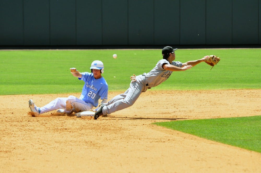 Gamecocks second baseman Max Schrock dives and misses a throw to second.