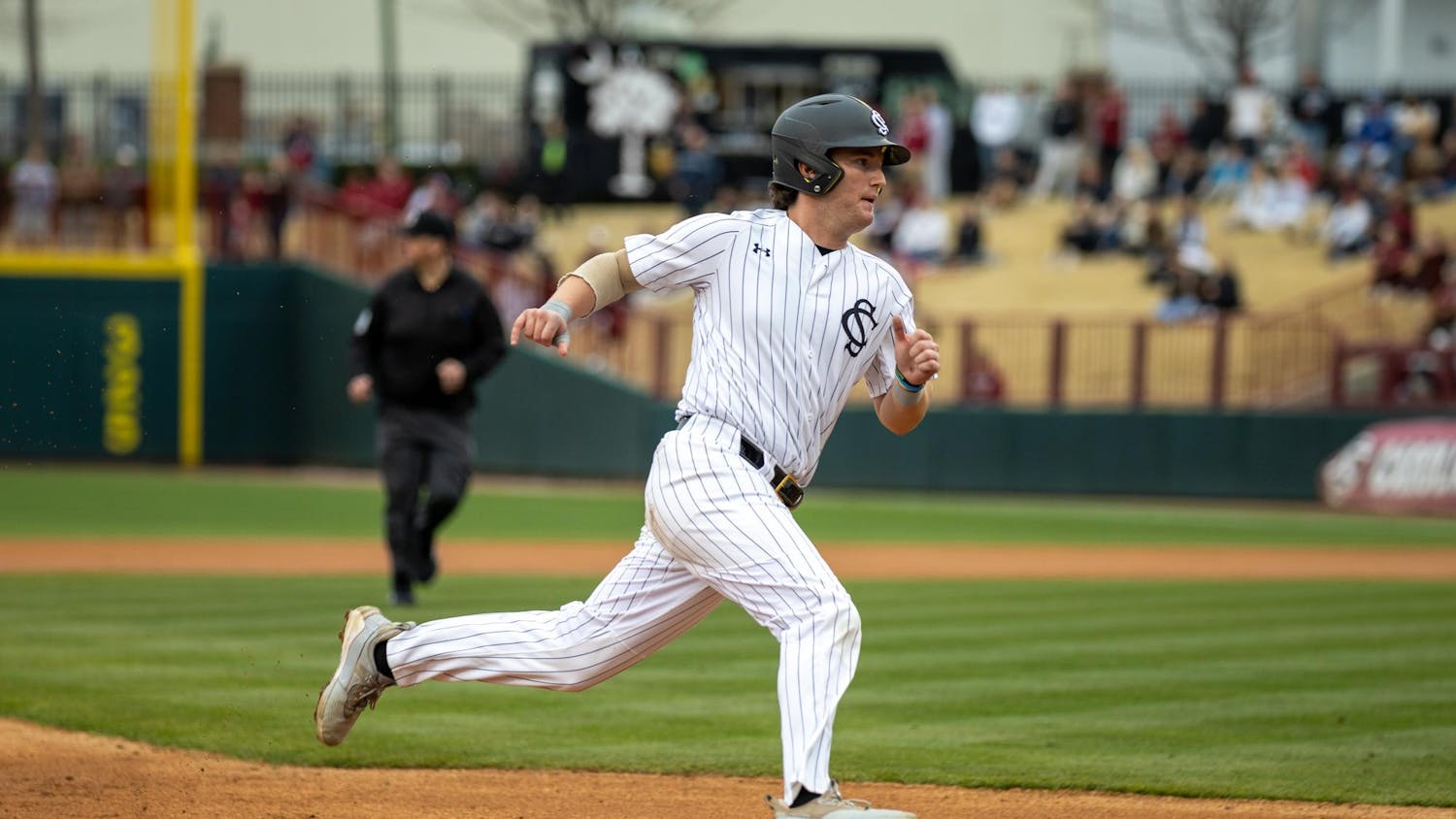 Senior catcher Talmadge LeCroy rounds third base on a hit in a game against Sacred Heart University on Feb. 15, 2025, at Founders Park. LeCroy later scored on a flyout from senior outfielder Dalton Mashore.