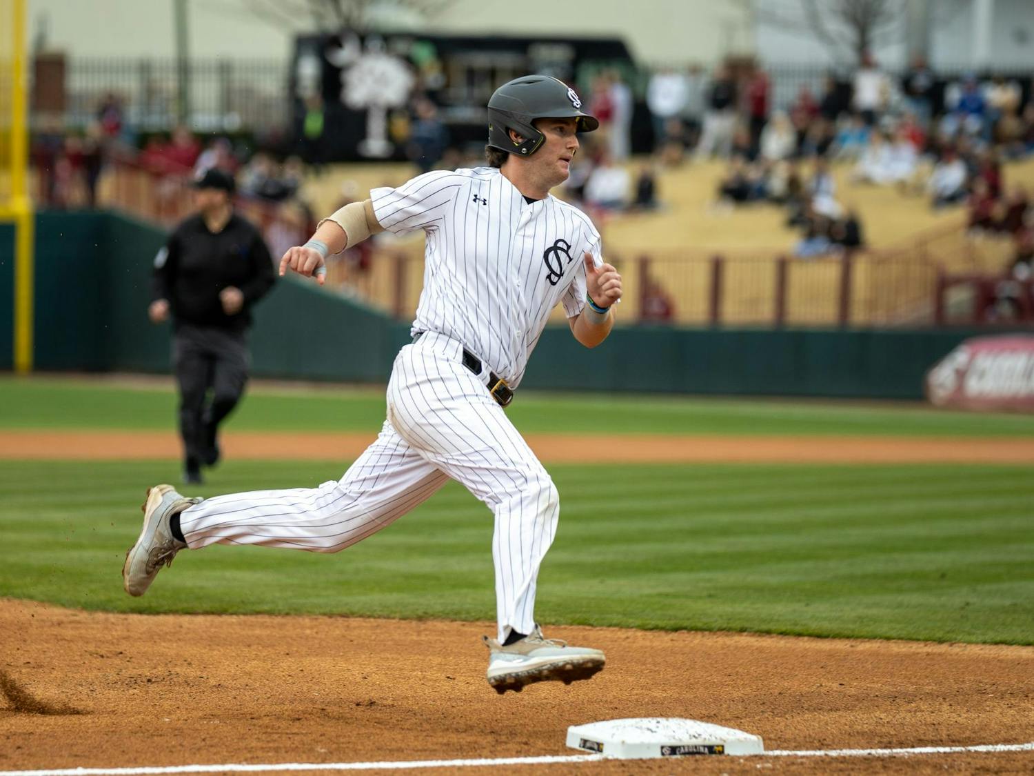 Senior catcher Talmadge LeCroy rounds third base on a hit in a game against Sacred Heart University on Feb. 15, 2025, at Founders Park. LeCroy later scored on a flyout from senior outfielder Dalton Mashore.
