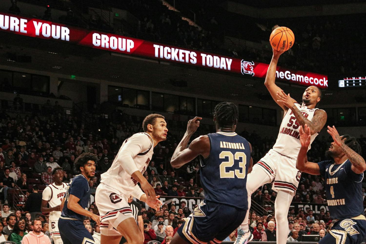 Graduate ɫɫƵ guard Ta’lon Cooper soars above the defense in the game against George Washington on Dec. 1, 2023. Cooper, a transfer from Minnesota, has led South Carolina in assists each of the first seven games of the season.