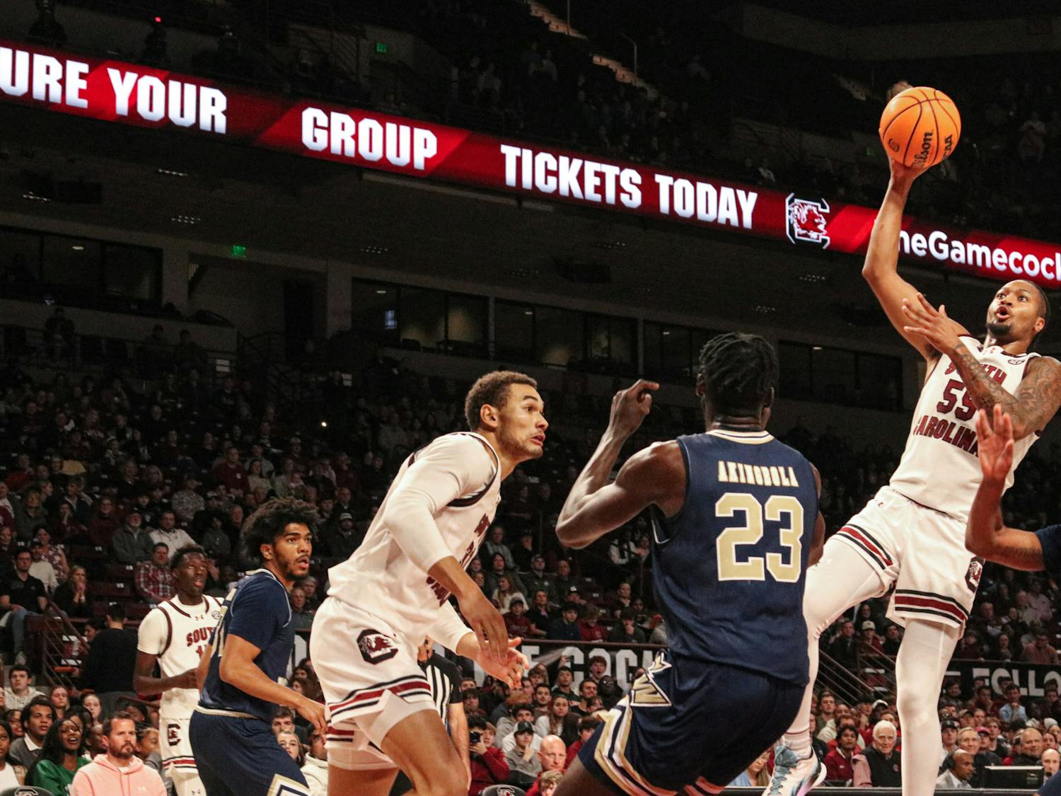 Graduate student guard Ta’lon Cooper soars above the defense in the game against George Washington on Dec. 1, 2023. Cooper, a transfer from Minnesota, has led South Carolina in assists each of the first seven games of the season.
