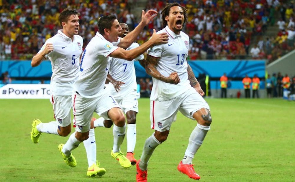 Jun 22, 2014; Manaus, Amazonas, BRAZIL; USA midfielder Jermaine Jones	(13) celebrates with teammates after scoring a second half goal against Portugal during the 2014 World Cup at Arena Amazonia. Mandatory Credit: Mark J. Rebilas-USA TODAY Sports