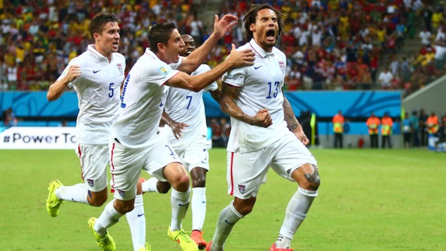 Jun 22, 2014; Manaus, Amazonas, BRAZIL; USA midfielder Jermaine Jones	(13) celebrates with teammates after scoring a second half goal against Portugal during the 2014 World Cup at Arena Amazonia. Mandatory Credit: Mark J. Rebilas-USA TODAY Sports