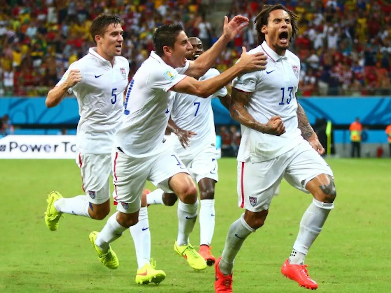 Jun 22, 2014; Manaus, Amazonas, BRAZIL; USA midfielder Jermaine Jones (13) celebrates with teammates after scoring a second half goal against Portugal during the 2014 World Cup at Arena Amazonia. Mandatory Credit: Mark J. Rebilas-USA TODAY Sports