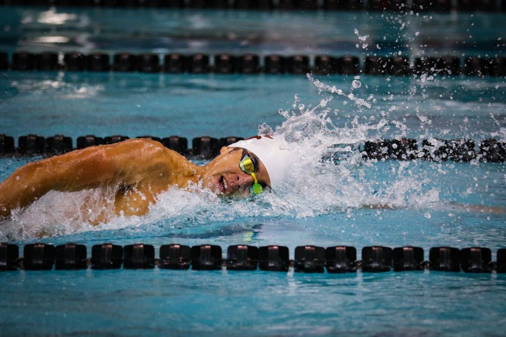 <p>Sophomore middle distance freestyle swimmer Rafael Davila swims in the men’s 1000-meter freestyle against NC State University.</p>