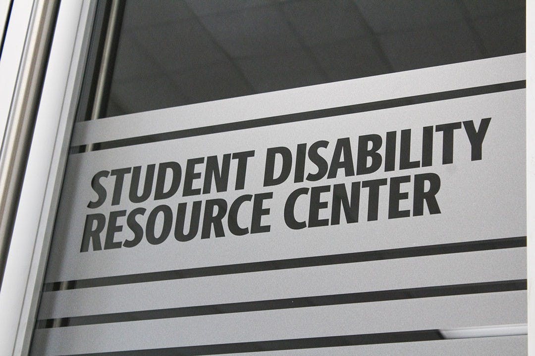 Signage on the door of the newly relocated Student Disabilities Resource Center in Close-Hipp, Suite 102.