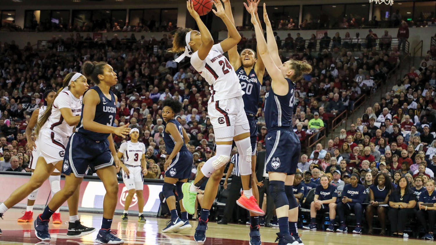 Graduate student guard LeLe Grissett shoots the ball over UConn defenders on Feb. 10, 2020. South Carolina women's basketball won the first game against UConn in school history 70-52.
