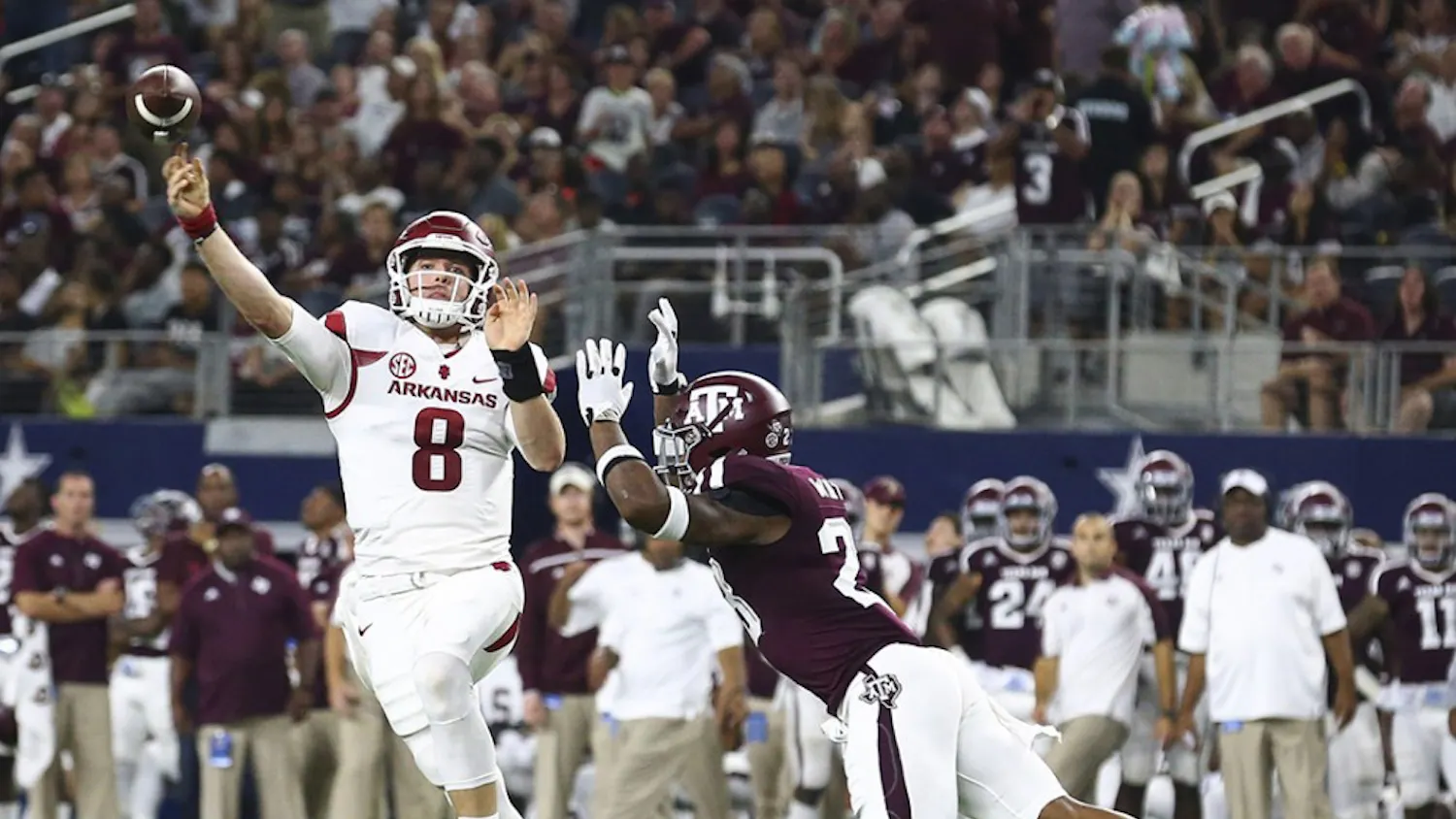 Arkansas quarterback Austin Allen (8) passes under pressure from Texas A&M defensive back Armani Watts (23) in the second quarter at AT&T Stadium in Arlington, Texas, on Saturday, Sept. 24, 2016. (Richard W. Rodriguez/Fort Worth Star-Telegram/TNS)