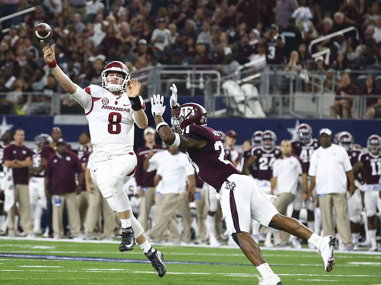Arkansas quarterback Austin Allen (8) passes under pressure from Texas A&M defensive back Armani Watts (23) in the second quarter at AT&T Stadium in Arlington, Texas, on Saturday, Sept. 24, 2016. (Richard W. Rodriguez/Fort Worth Star-Telegram/TNS)