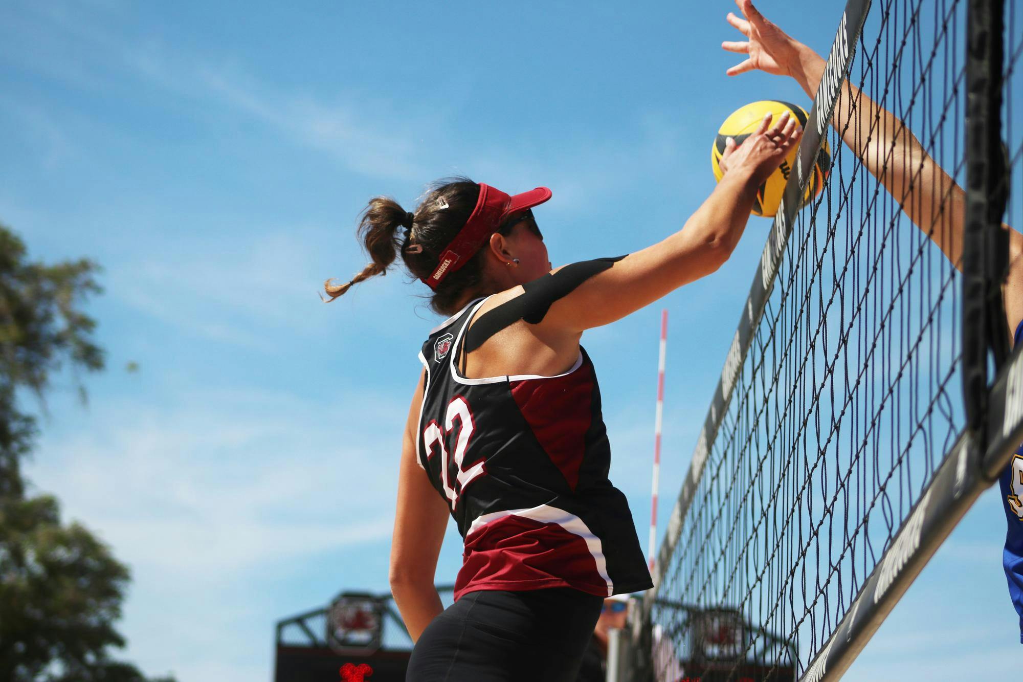 Graduate student Allison Coens blocks a pass made by Morehead State during a match at Wheeler Beach on April 7, 2024. The Gamecocks took home a 5-0 win against the Beakers.