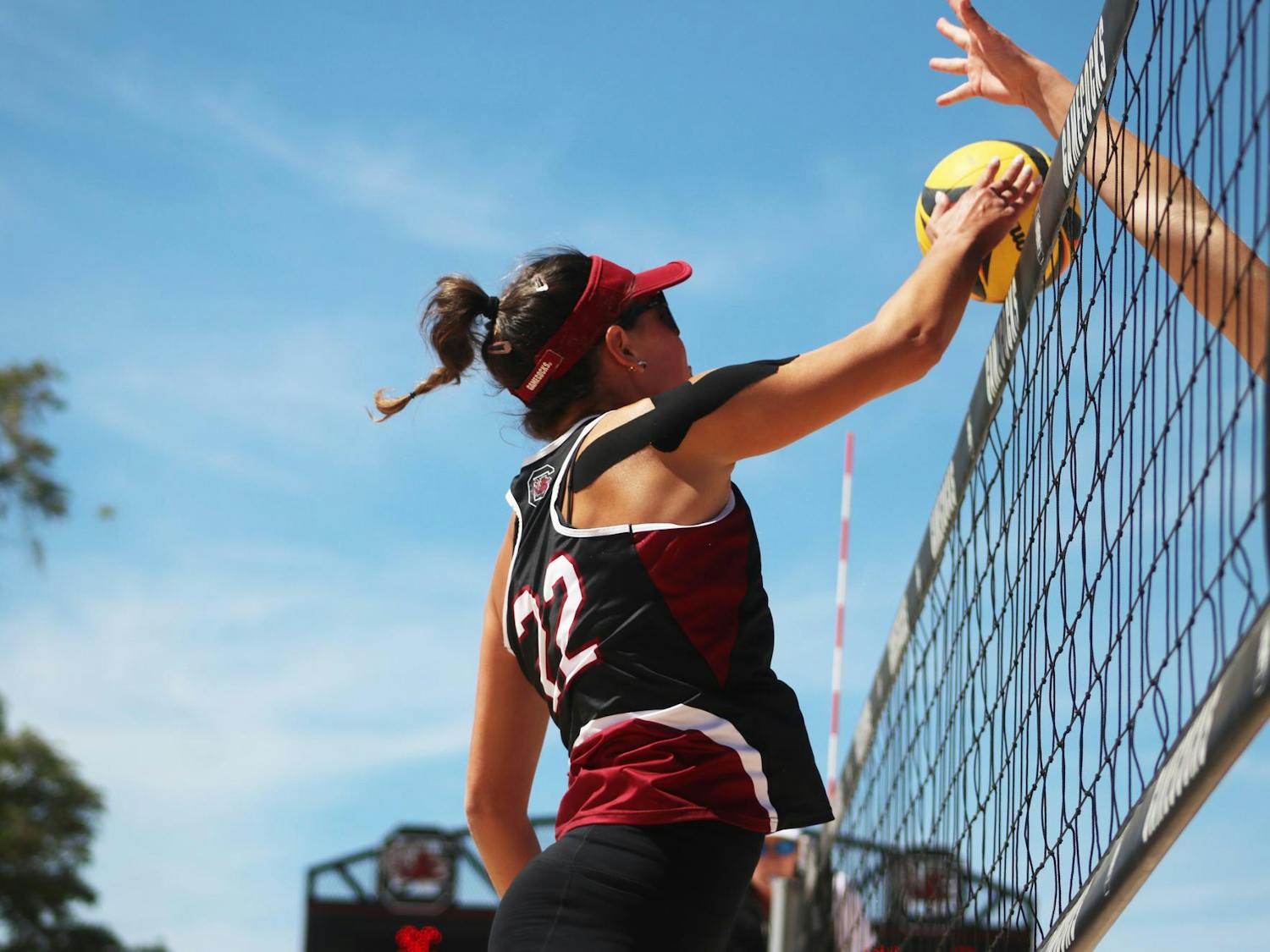 Graduate student Allison Coens blocks a pass made by Morehead State during a match at Wheeler Beach on April 7, 2024. The Gamecocks took home a 5-0 win against the Beakers.