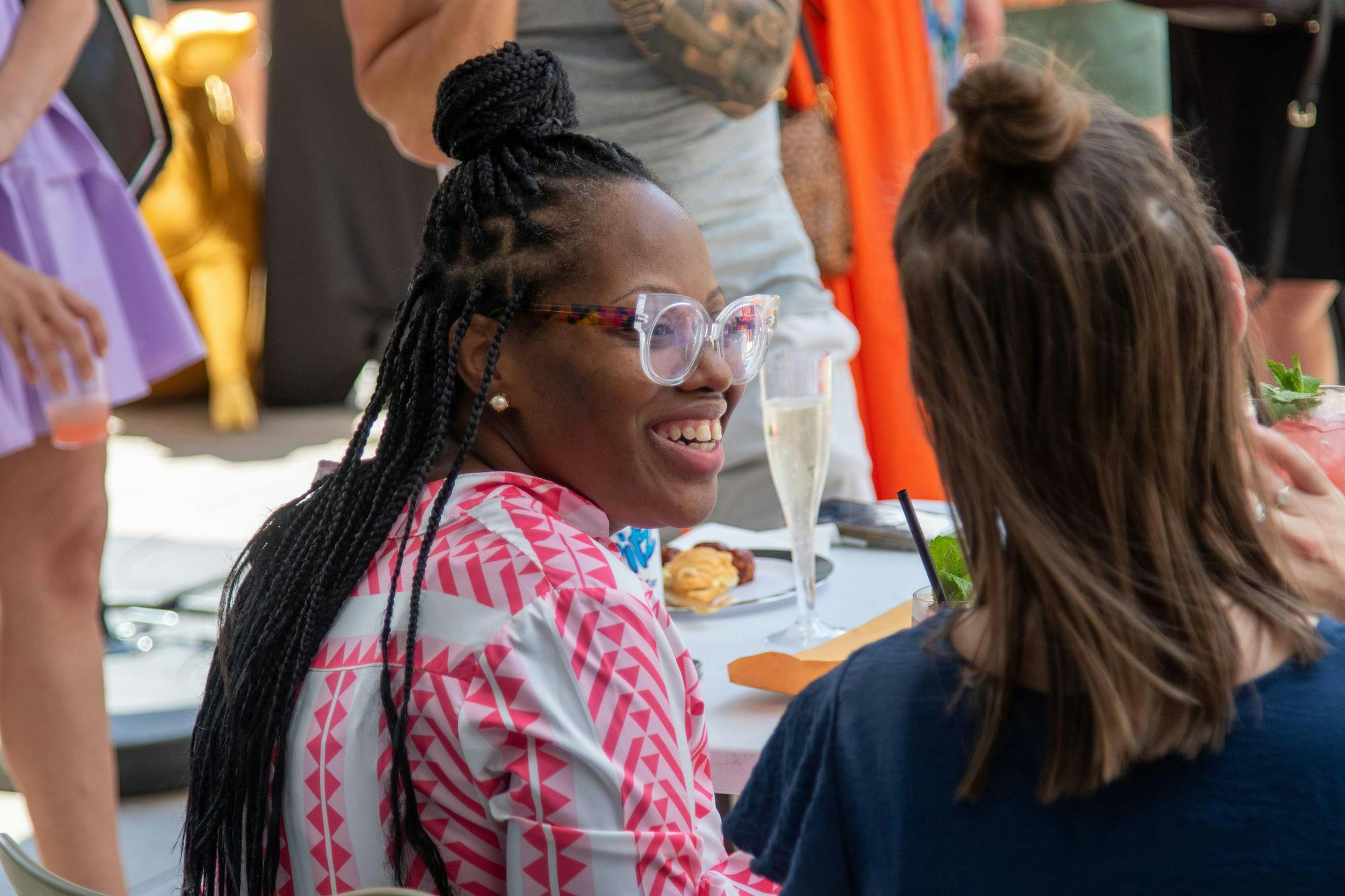 Eboni Page smiles and talks to other judges during the competition on June 9, 2024. Page is an award-winning mixologist and judge of the Capital City Cocktail Competition, as well as the owner of Bubblee Mixologist.