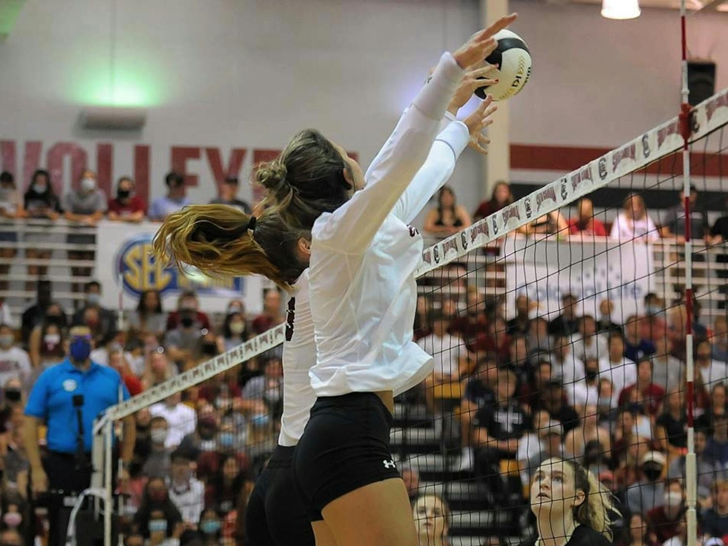 Sophomore blocker Ellie Ruprich returns the volleyball to the Knights next to freshman right side Lauren McCutcheon. The Gamecocks beat the Knights in 3-1 sets, and maintained their undefeated streak. 