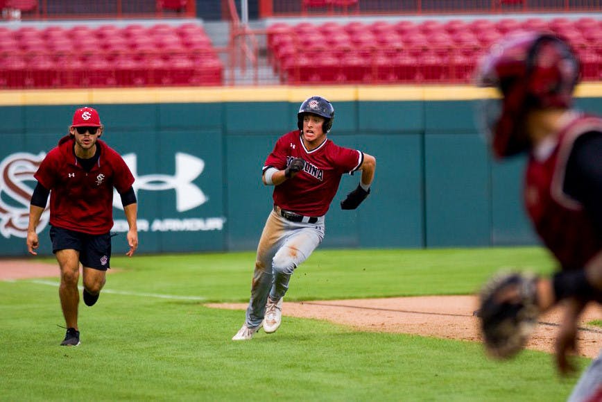 Sophomore outfielder Evan Stone rounds third base and slides into home, putting the Garnet team up 2-0 against the Black team on Nov. 5, 2022. Stone scored a total of 16 runs for the Gamecocks in the 2022 season.&nbsp;
