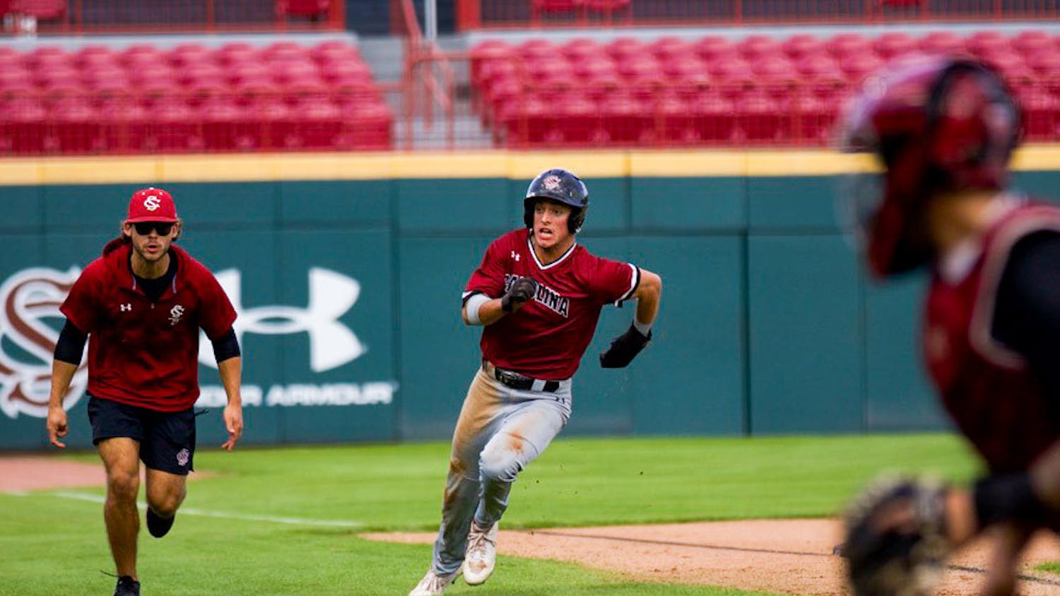 Sophomore outfielder Evan Stone rounds third base and slides into home, putting the Garnet team up 2-0 against the Black team on Nov. 5, 2022. Stone scored a total of 16 runs for the Gamecocks in the 2022 season.&nbsp;