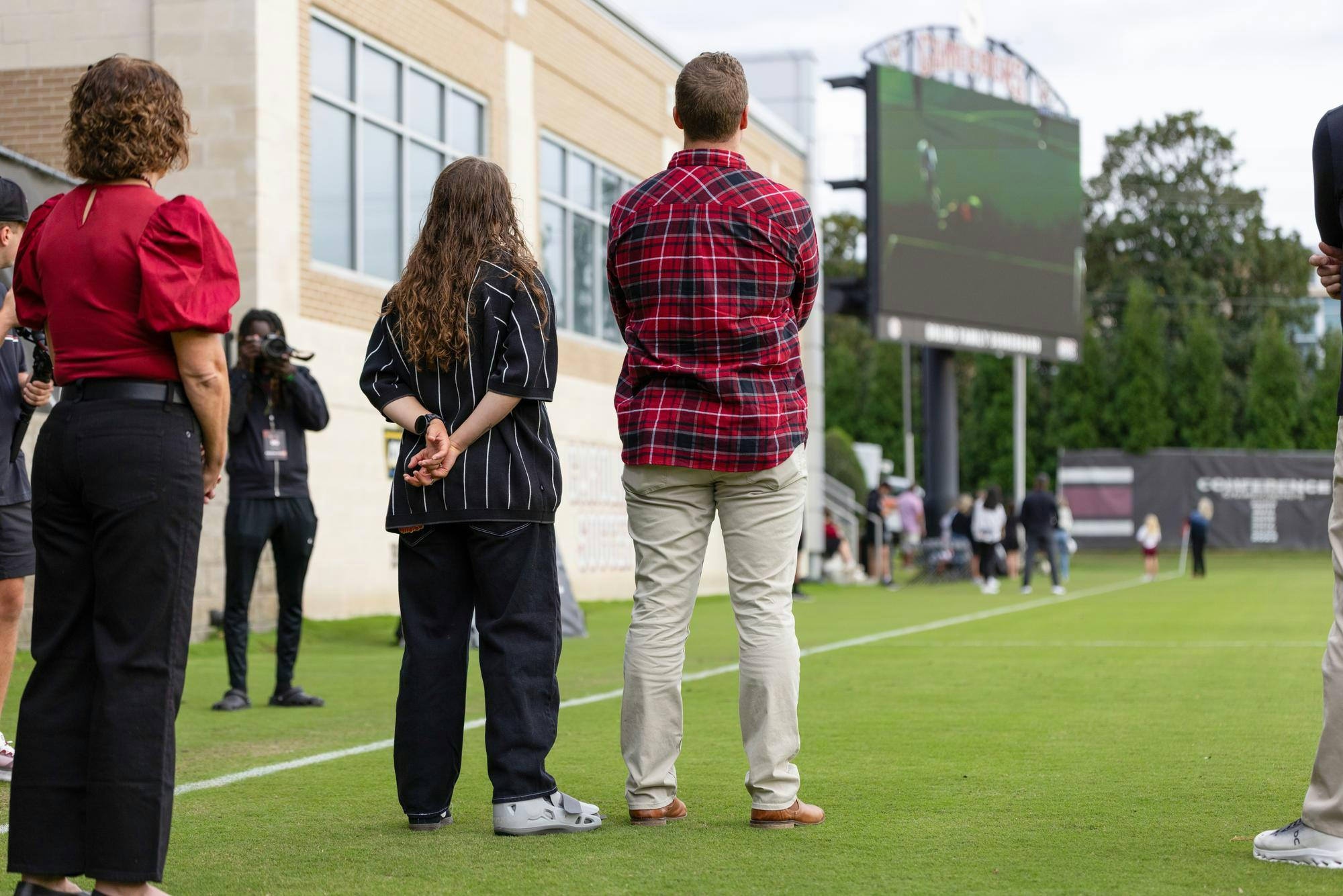 Savannah McCaskill and her husband watch a video at Stone Stadium before the women’s soccer game against Texas A&amp;M on Oct. 19, 2025. The video was a collection of McCaskill's best goals and some interviews from her time at USC.