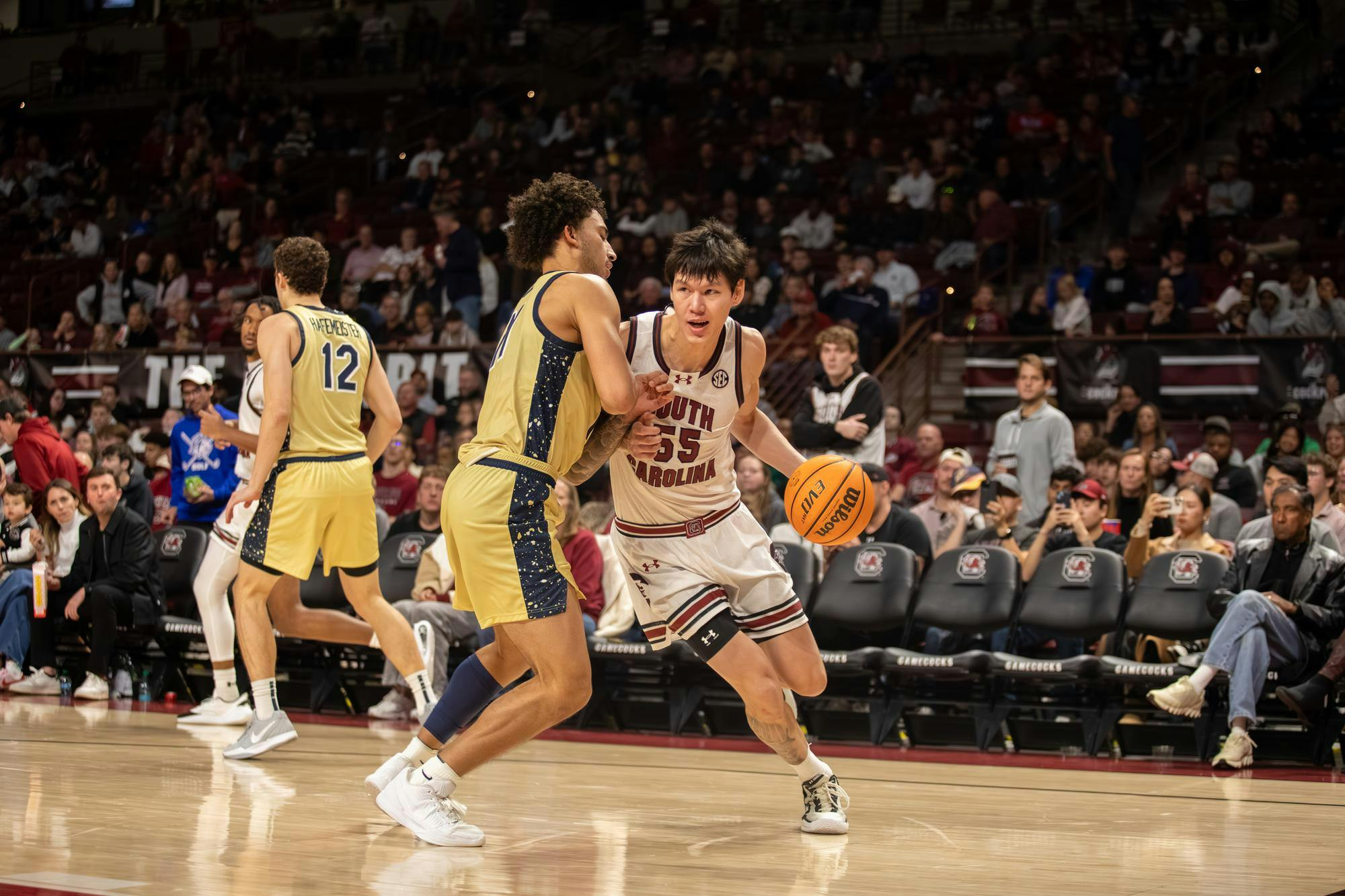 FILE — Senior guard Mike Sharavjamts dribbles the ball around an opposing player during the game against Charleston Southern University on Nov. 28, 2025. Sharavjamts has averages a career high 53.6% field goal rate during his first season with the Gamecocks. 