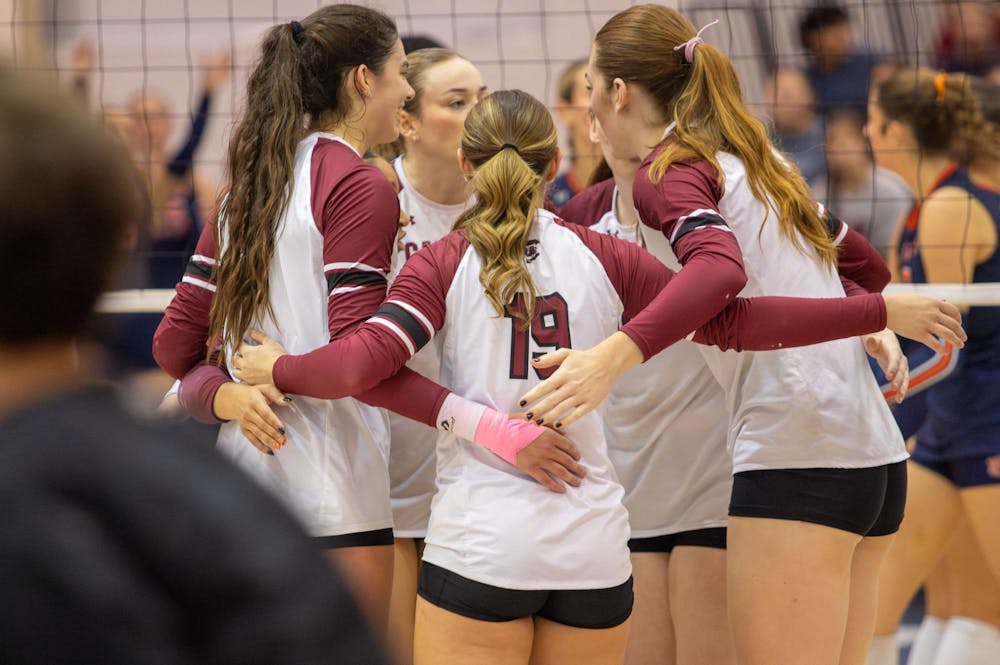 <p>Gamecocks celebrate after winning a point against Auburn on Oct. 26, 2024 in Columbia, S.C. The team marked senior night with high energy as they rallied together for a victory.</p>