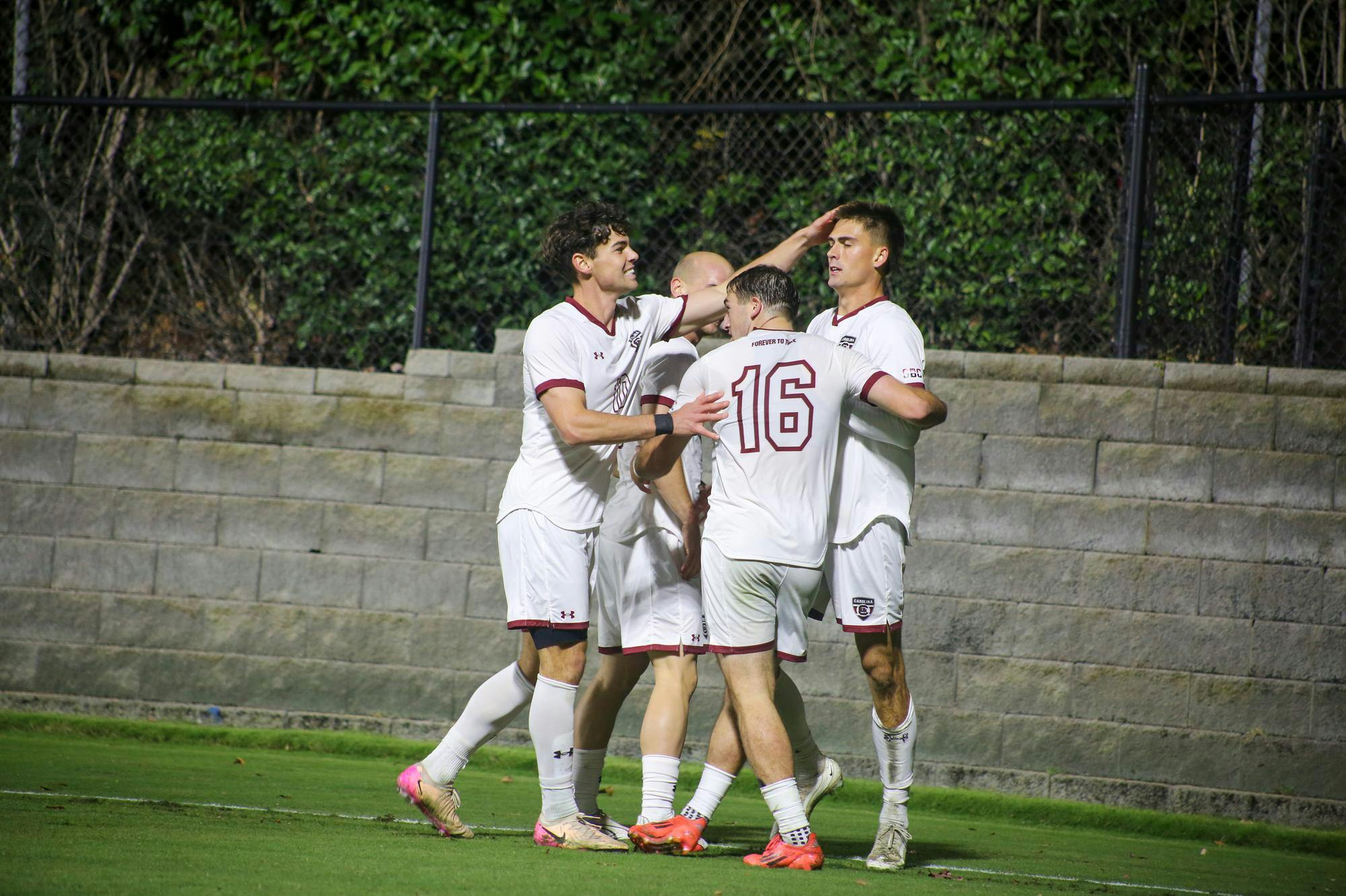 Senior forward Tyler Trimnal celebrates scoring a goal in the first half of the game against Coastal Carolina with his teammates at Eugene E. Stone III Stadium on Oct. 26, 2025. Trimnal scored the only goal, the match ending 3-1.