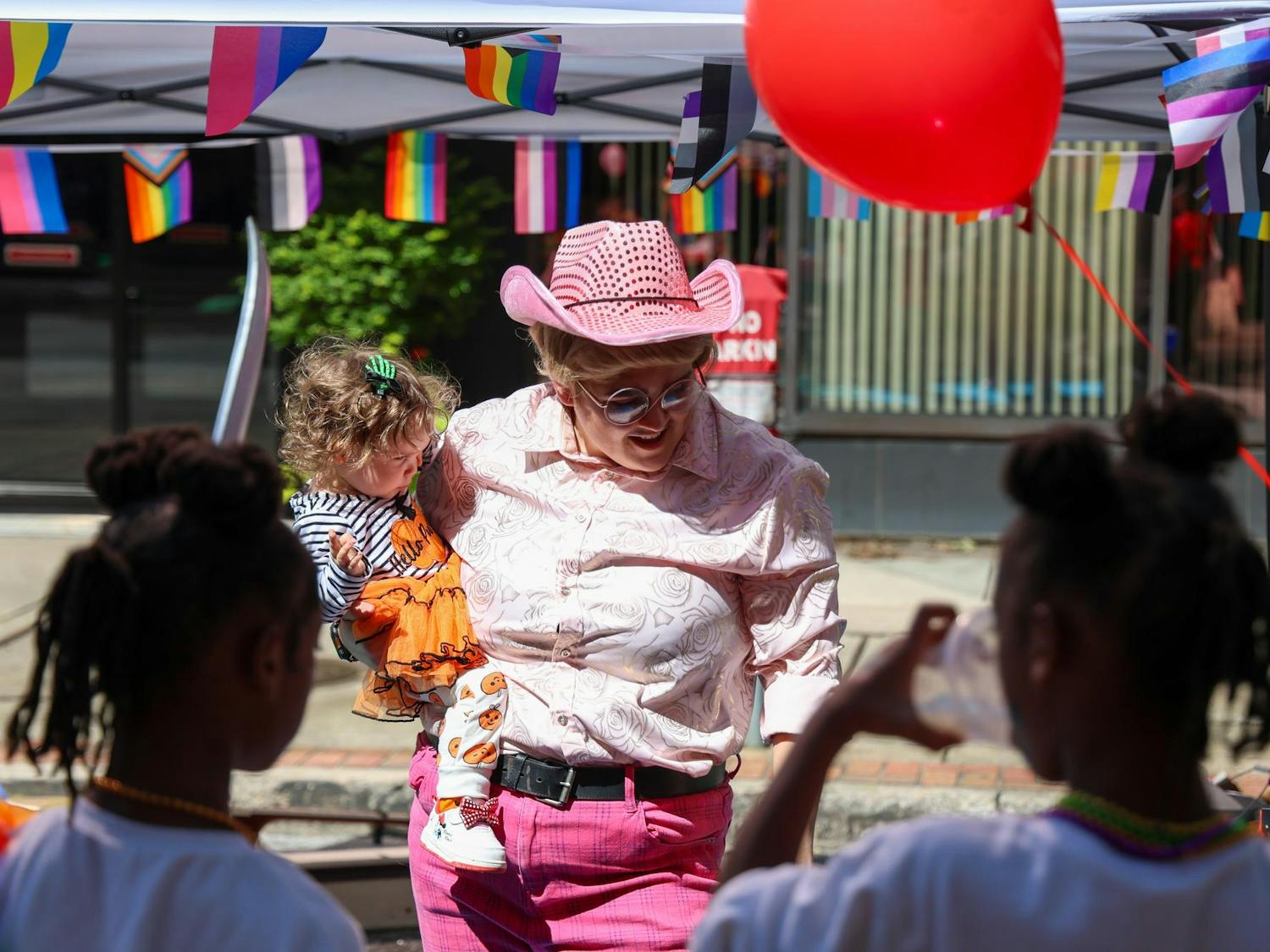 Columbia drag king Marty McGuy plays with a group of kids at the Family Pride area of the Famously Hot SC Pride Festival on Oct. 4, 2025. McGuy is a frequent Drag Storytime performer.