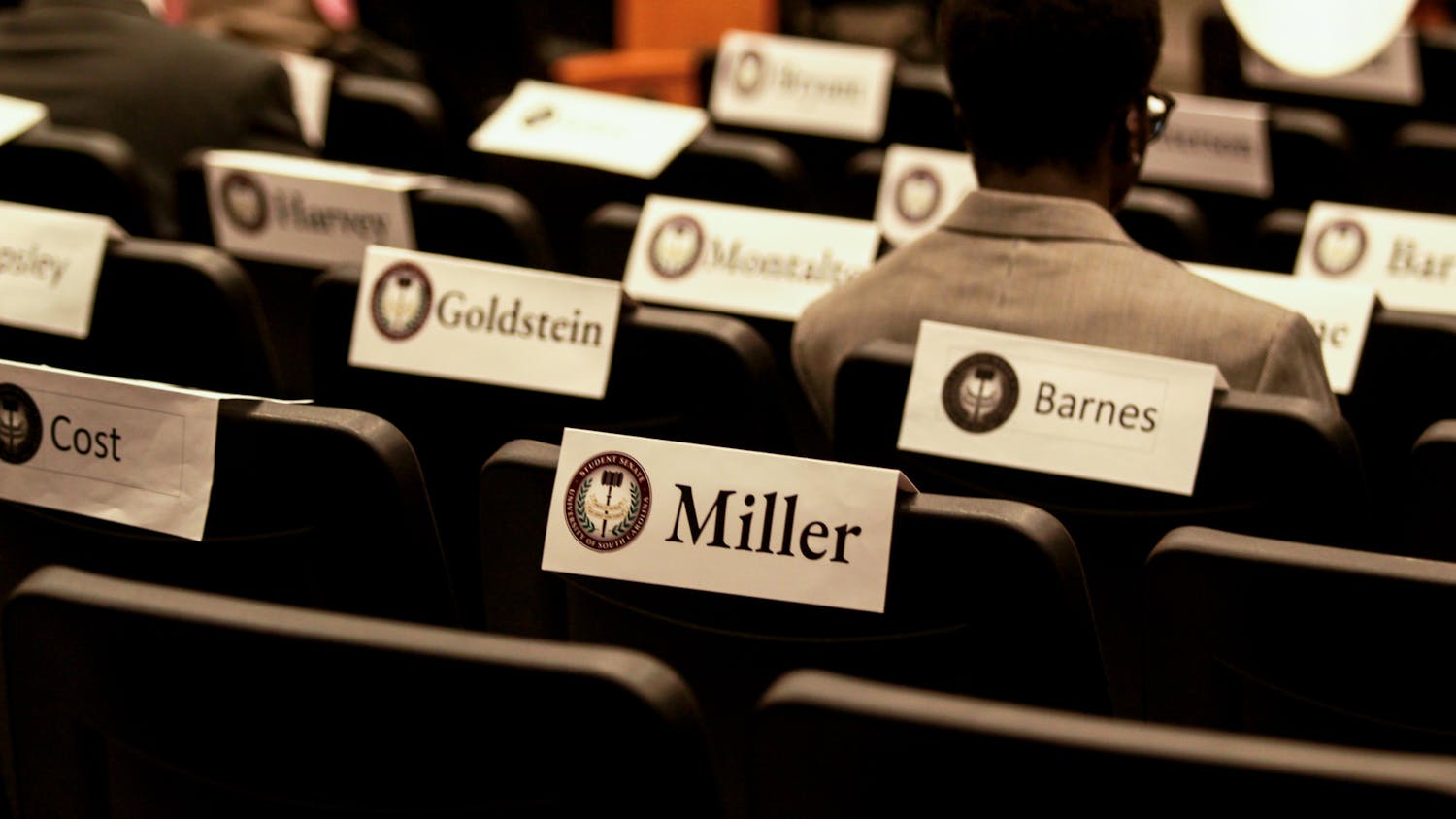 FILE — Name cards cover the backs of seats as members of the student senate begin to enter for their meeting on Oct. 4. Members represent all grade levels of the student body.