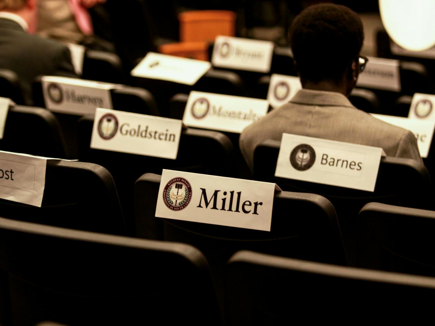 FILE — Name cards cover the backs of seats as members of the student senate begin to enter for their meeting on Oct. 4. Members represent all grade levels of the student body.