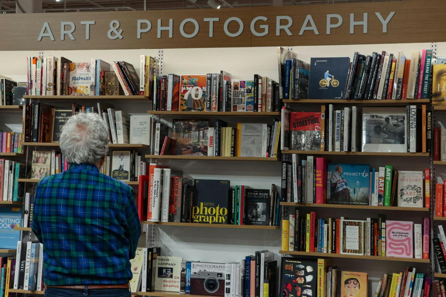A customer browses the art &amp; photography section in the new Columbia Barnes &amp; Noble on March 11, 2024. The store on Garners Ferry Road has several sections, including art &amp; photography, young adult, horror, vinyl, local authors and more.