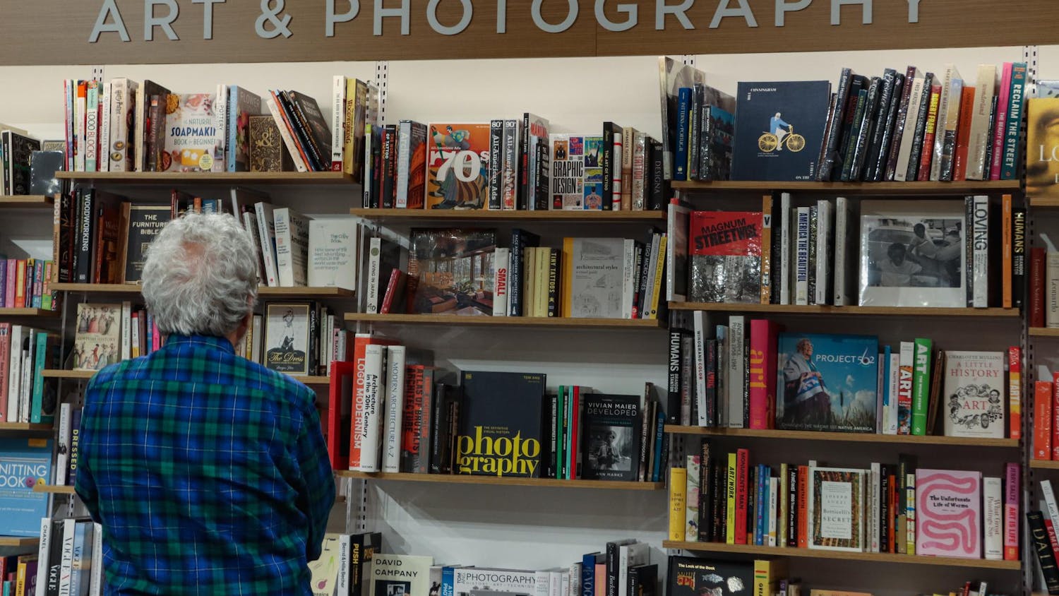A customer browses the art &amp; photography section in the new Columbia Barnes &amp; Noble on March 11, 2024. The store on Garners Ferry Road has several sections, including art &amp; photography, young adult, horror, vinyl, local authors and more.