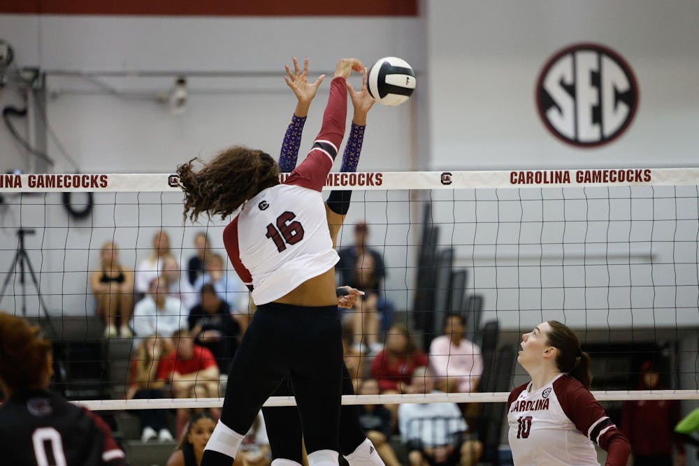 <p>Senior middle blocker Oby Anadi hits the ball during the final moments of the second set against East Carolina University on Sept. 17, 2024. Anadi completed the game with 11 kills.</p>