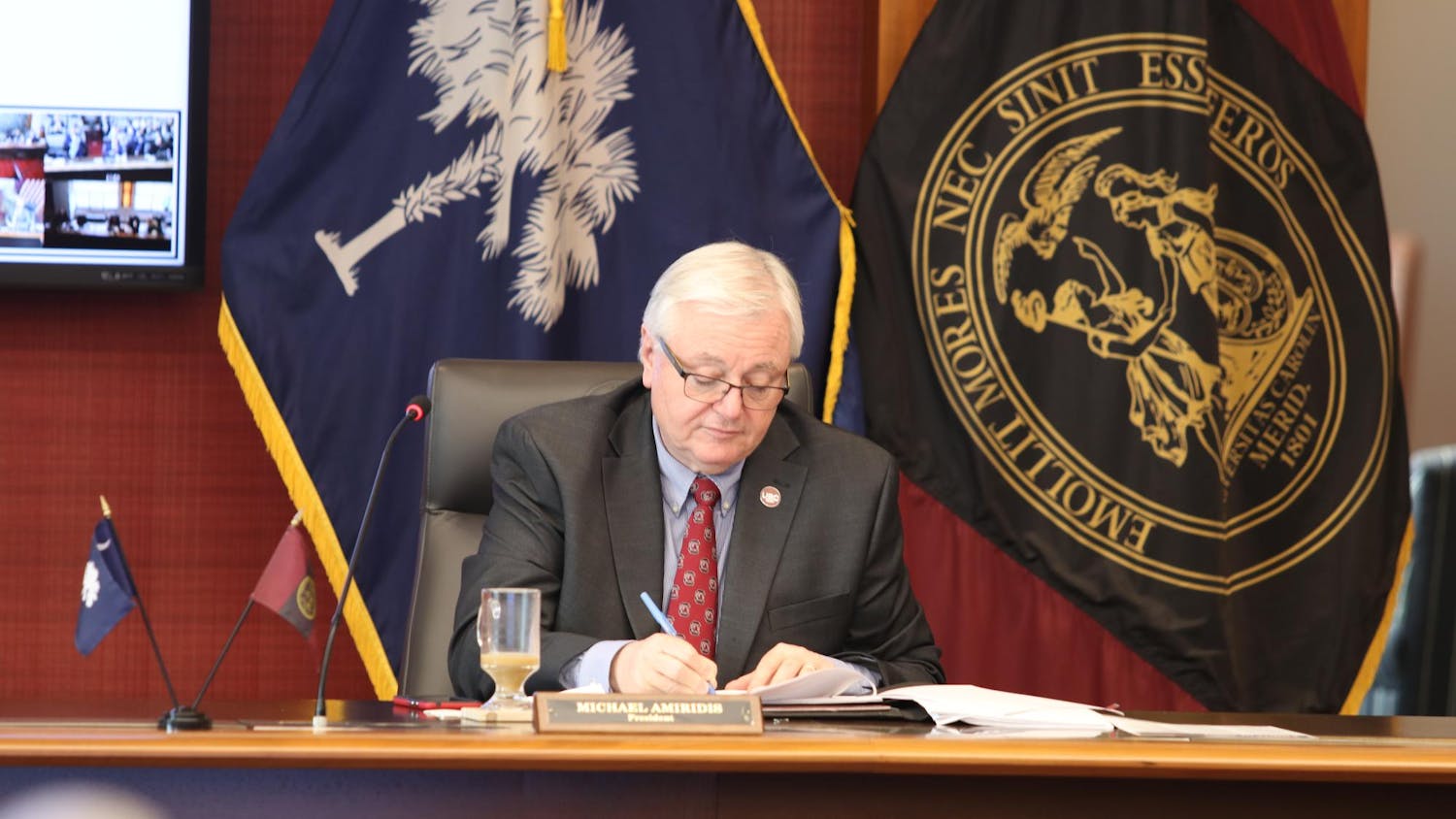 University of South Carolina President Michael Amiridis takes notes during a board of trustees meeting on March 18, 2024. Amiridis is serving as the university’s 30th president.