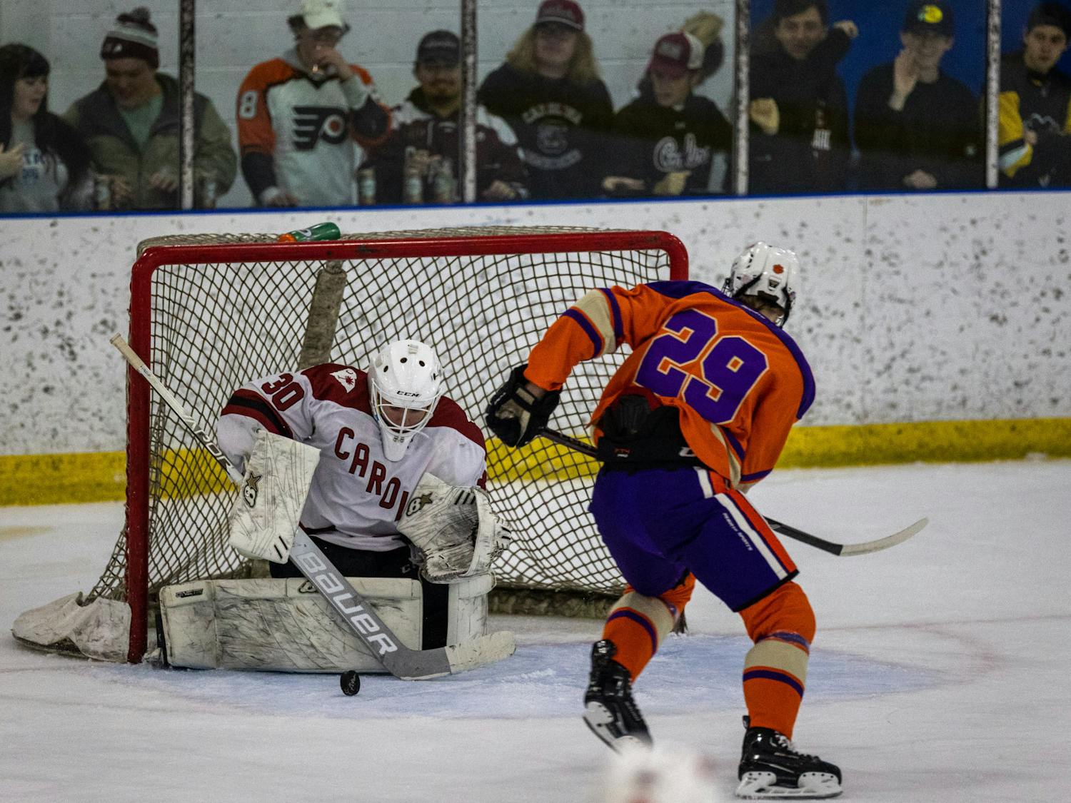 Senior goalie Liam Gormley deflects the puck from an advancing Clemson opponent on Nov. 11, 2022. Clemson failed to overcome the defensive strides from the South Carolina club hockey team, coming up short against the Gamecocks 5-4.