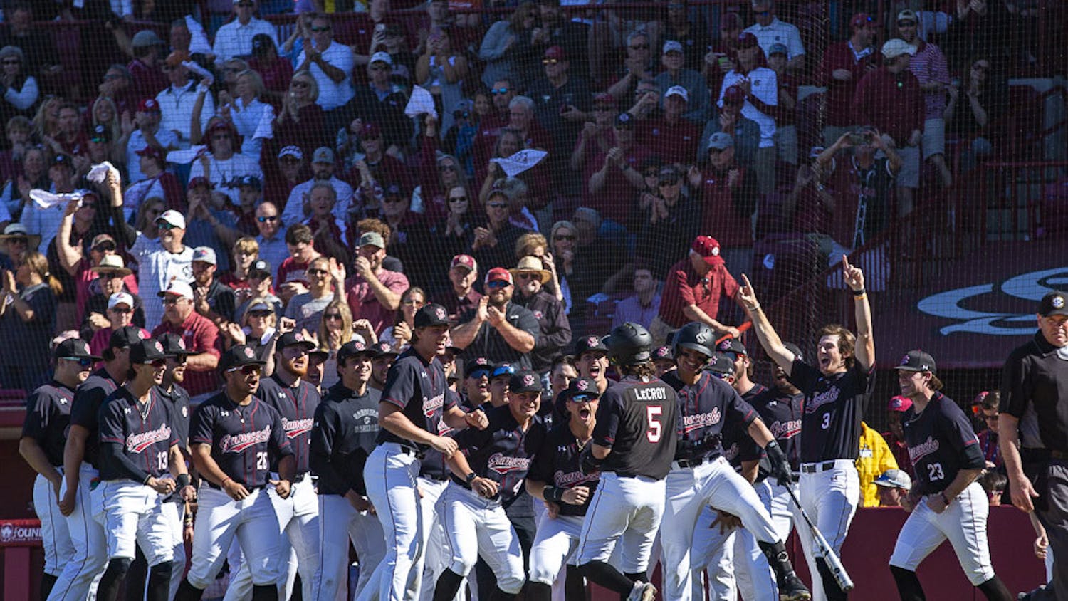 The South Carolina baseball team celebrates after junior first baseman Gavin Casas hits a home run in the fourth inning against Clemson at Founders Park on March 5, 2023. The Gamecocks beat the Tigers 7-1, defeating it 2-1 in the series.&nbsp;
