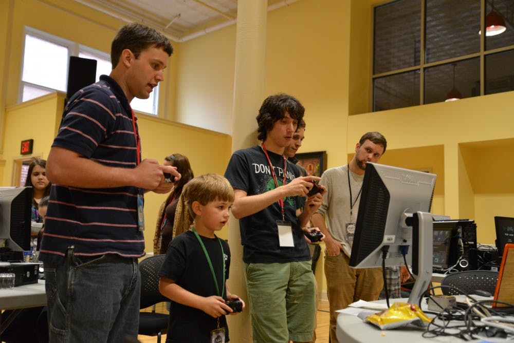 	Independent video game titles took over the Nickelodeon Theatre and the Agape Senior conference center on Tuesday.