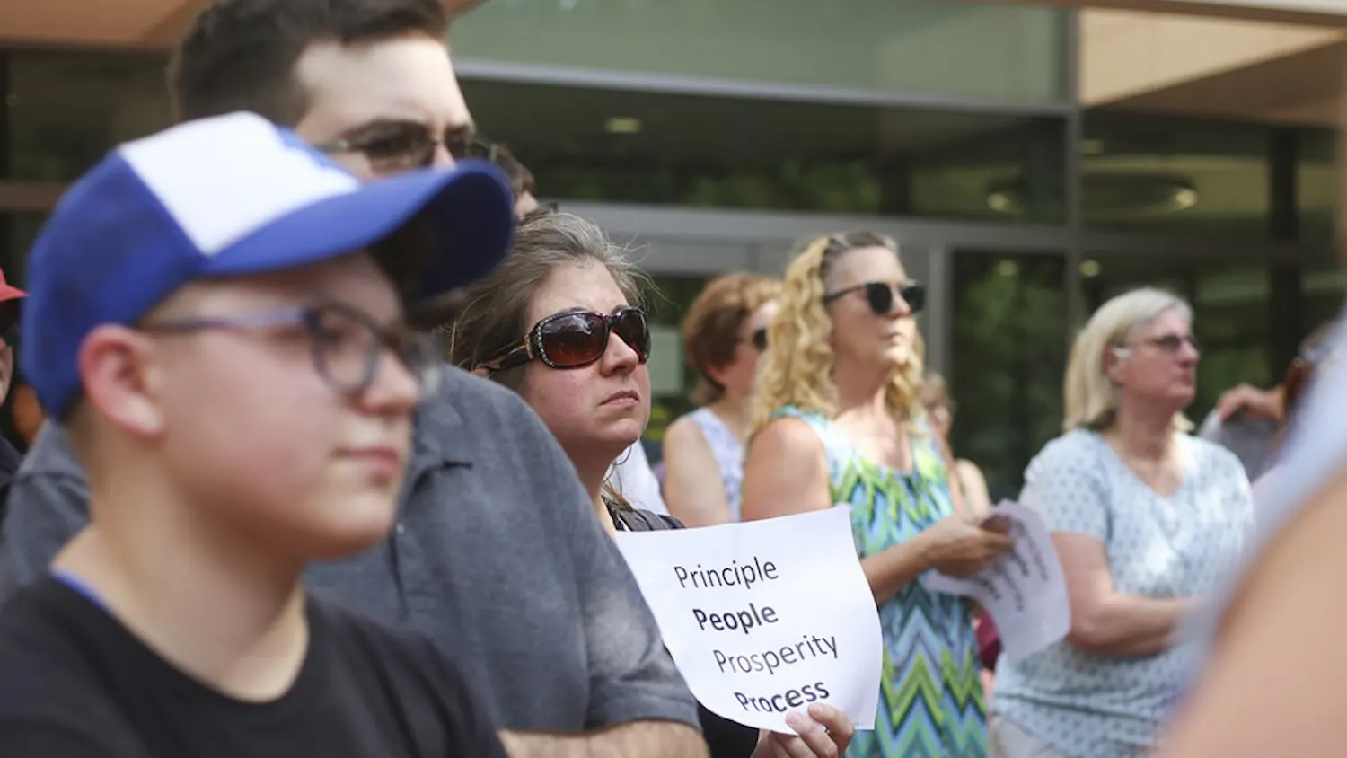 A supporter holds a sign during the "Gamecocks4Integrity" rally on the Russell House patio on Wednesday. 