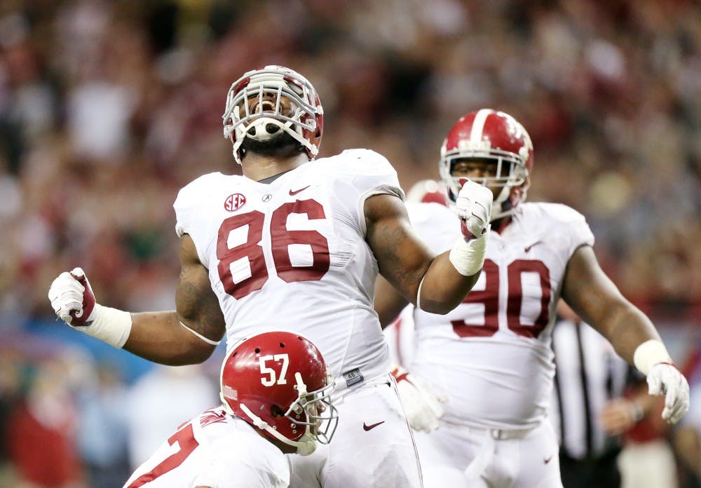 Alabama defensive lineman A'Shawn Robinson reacts after tackling Missouri running back Marcus Murphy for a three-yard loss in the third quarter of the 2014 SEC Championship Saturday, Dec. 6, 2014 at the Georgia Dome in Atlanta. Alabama won 42-13. (Chris Lee/St. Louis Post-Dispatch/TNS) 