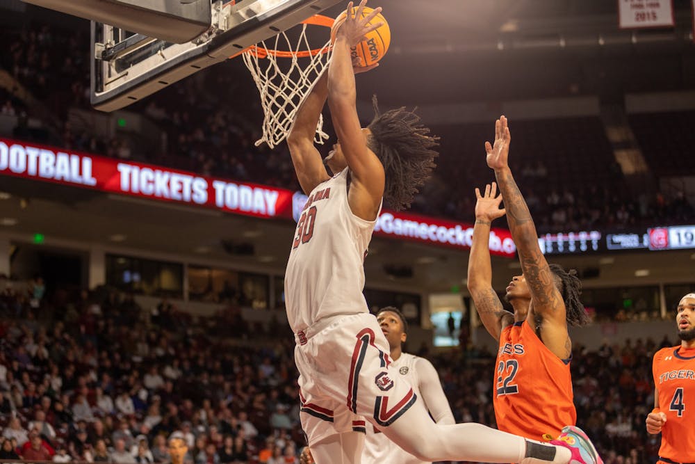 <p>Going for a slam dunk in the first half of the game, freshman forward Daniel Hankins-Sanford reaches for the basket to try to make another 2 points for South Carolina. The Gamecocks played the Tigers on Jan. 21, 2023, losing 81-66.&nbsp;</p>