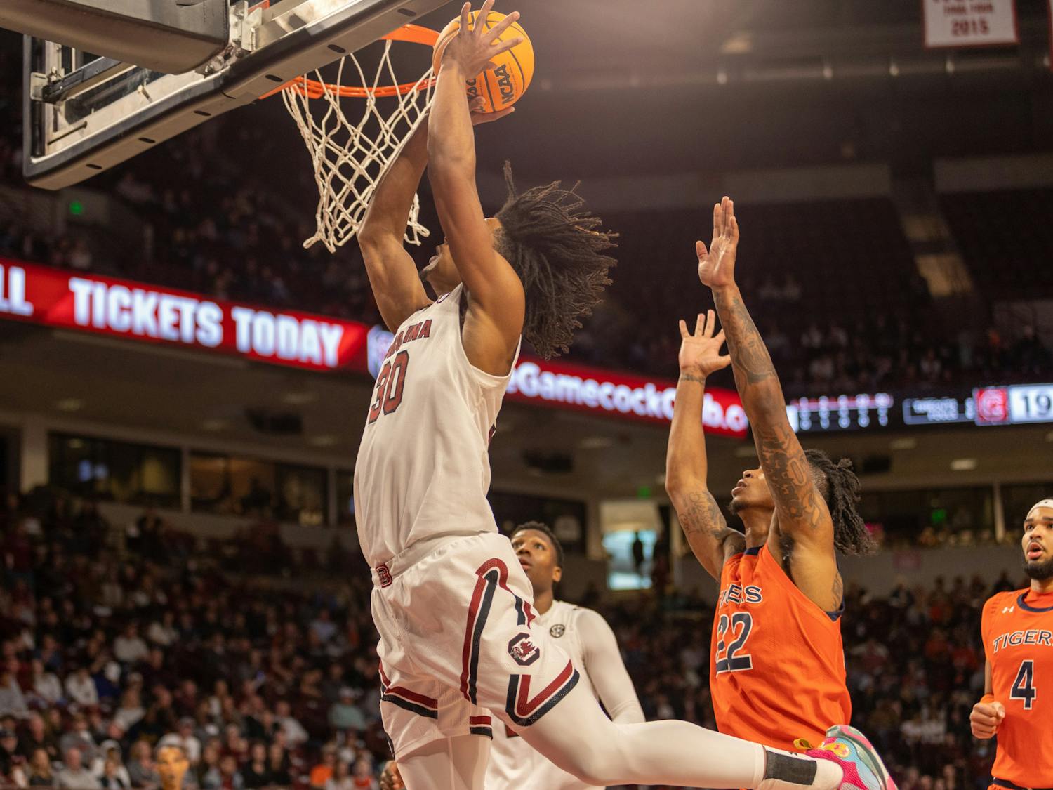 Going for a slam dunk in the first half of the game, freshman forward Daniel Hankins-Sanford reaches for the basket to try to make another 2 points for South Carolina. The Gamecocks played the Tigers on Jan. 21, 2023, losing 81-66. 