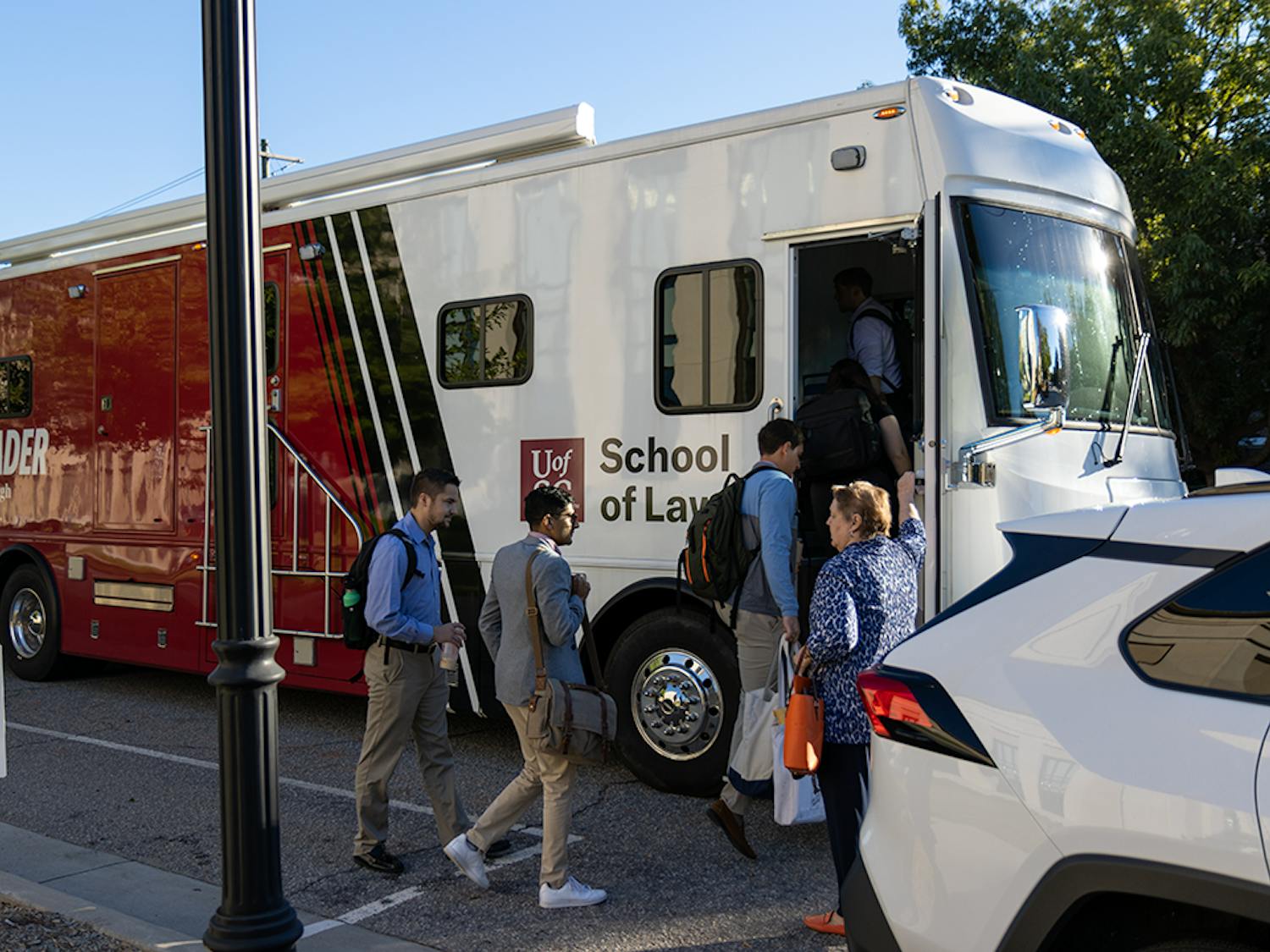 The Palmetto LEADER bus accepts its first passengers destined for rural South Carolina to offer legal services. This technology-equipped bus has office spaces and Wi-Fi for USC Law Students.