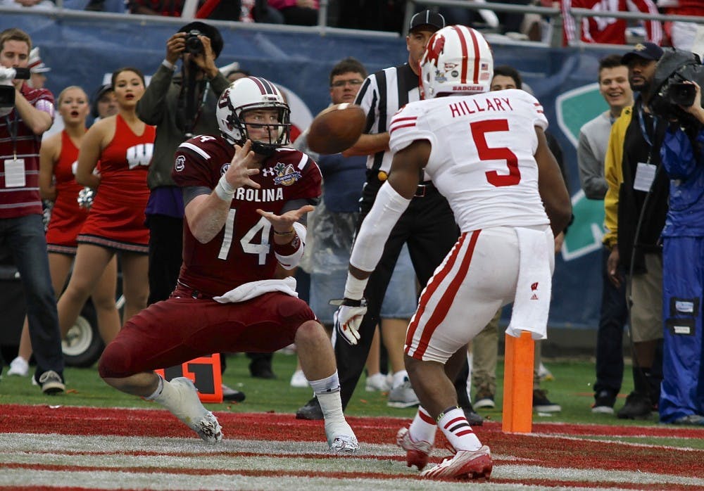 	Senior quarterback Connor Shaw hauls in the first reception of his career in the second quarter of the Gamecocks&#8217; 34-24 win over Wisconsin in the 2014 Capital One Bowl.