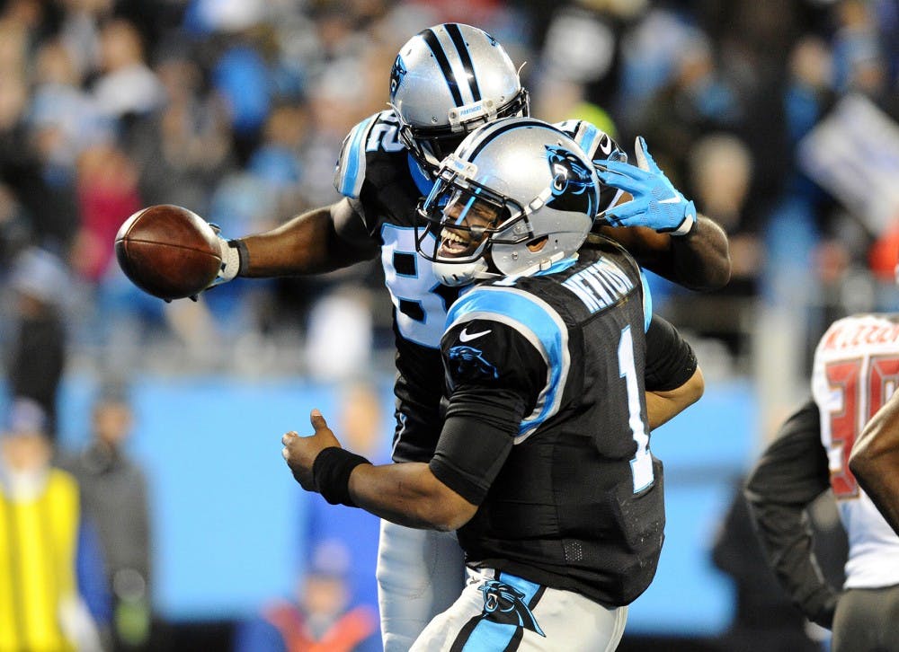 Carolina Panthers&apos; Cam Newton (1) celebrates with Jerricho Cotchery (82) after they connected on touchdown during the second quarter at on Sunday, Jan. 3, 2016, at Bank of America Stadium in Charlotte, N.C. (David T. Foster III/Charlotte Observer/TNS)