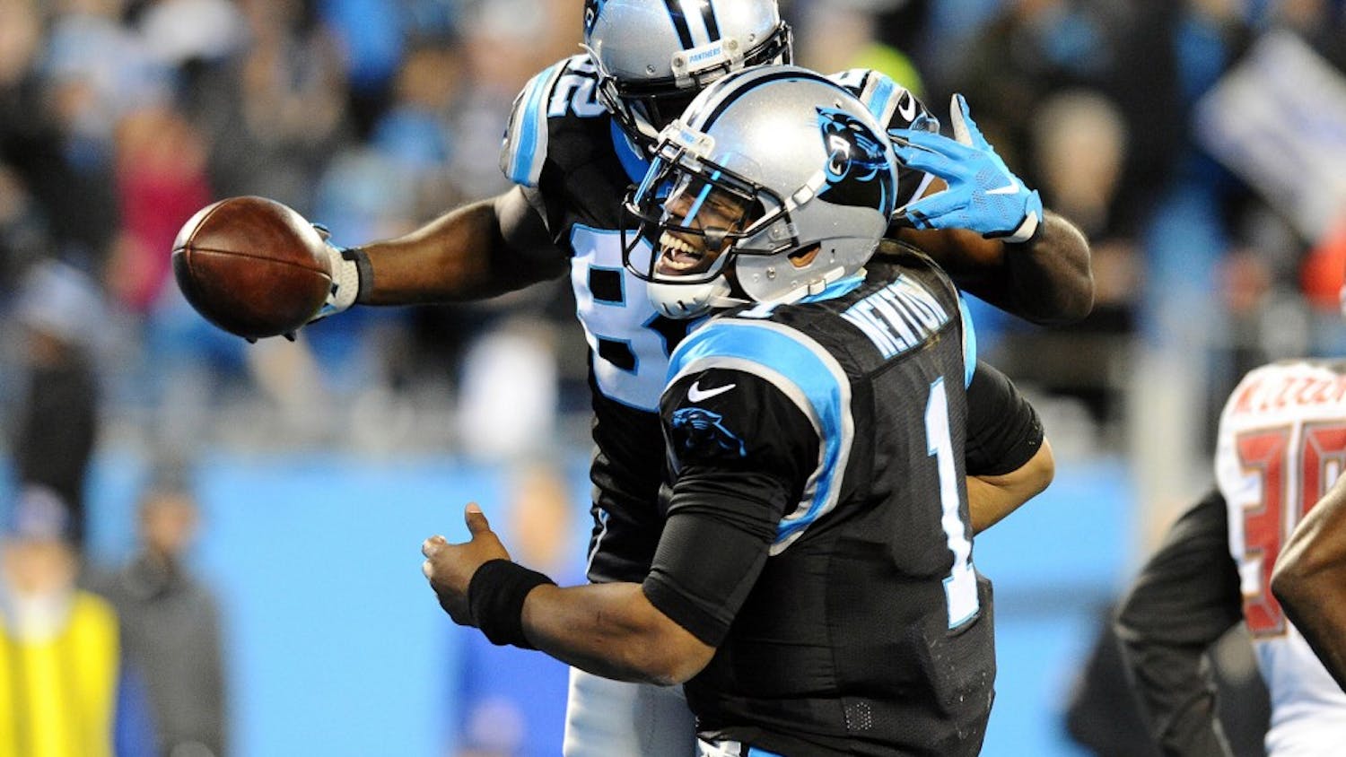 Carolina Panthers' Cam Newton (1) celebrates with Jerricho Cotchery (82) after they connected on touchdown during the second quarter at on Sunday, Jan. 3, 2016, at Bank of America Stadium in Charlotte, N.C. (David T. Foster III/Charlotte Observer/TNS)