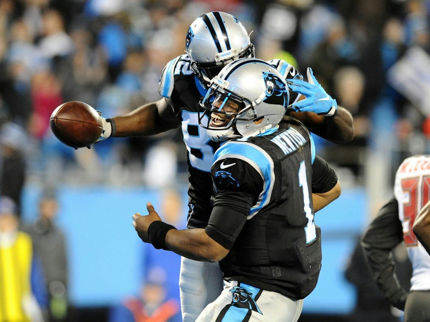 Carolina Panthers' Cam Newton (1) celebrates with Jerricho Cotchery (82) after they connected on touchdown during the second quarter at on Sunday, Jan. 3, 2016, at Bank of America Stadium in Charlotte, N.C. (David T. Foster III/Charlotte Observer/TNS)