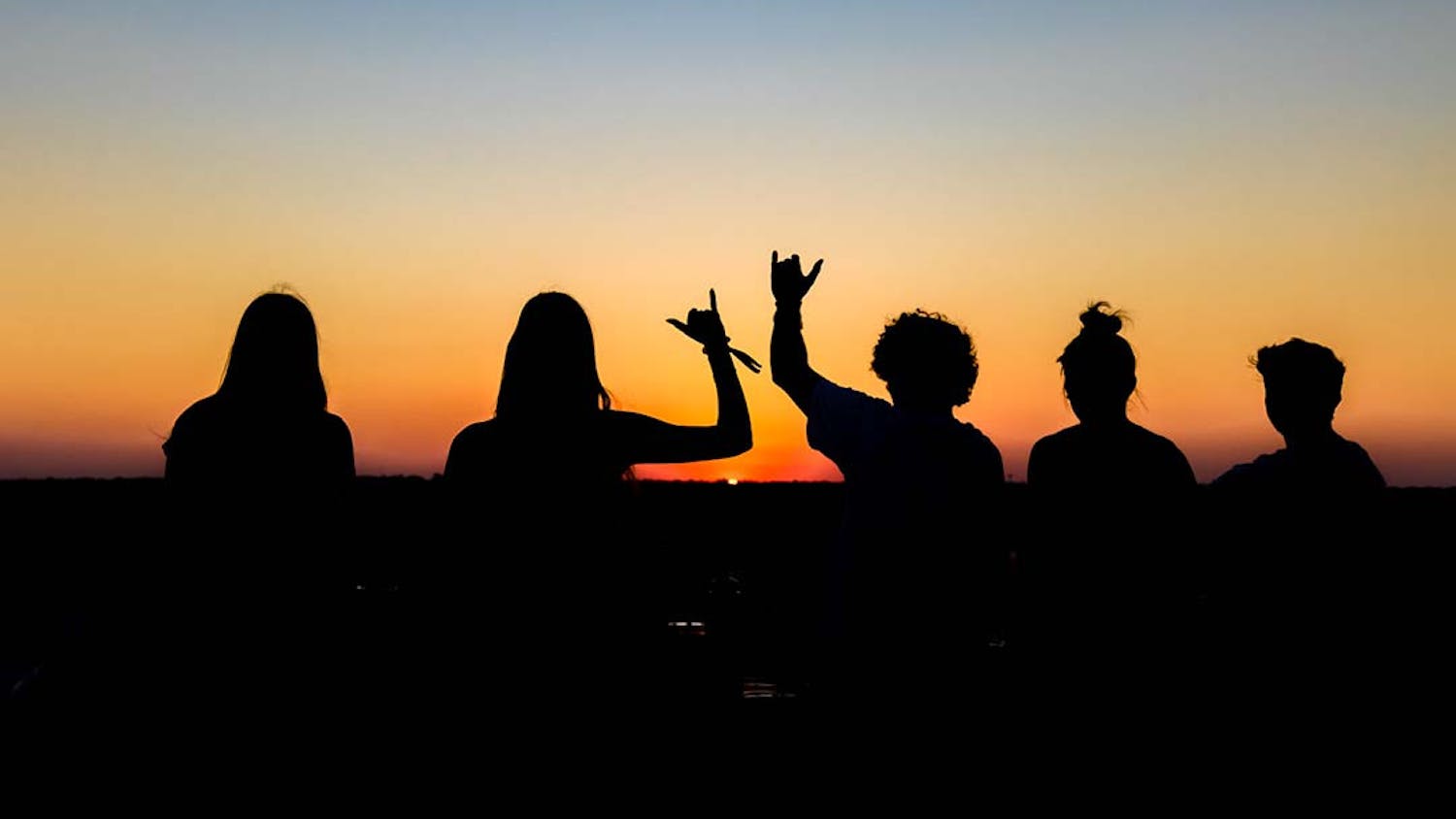 Students on the top of Horizon Garage watching the sunset on Sept. 21, 2022. The parking garage is located at 519 Main St, Columbia, SC, and offers great views of the city skyline.