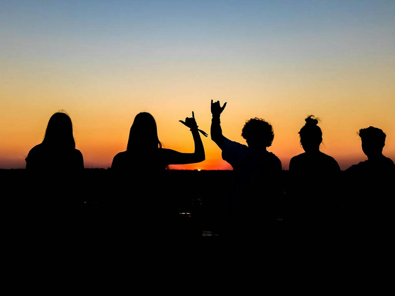 Students on the top of Horizon Garage watching the sunset on Sept. 21, 2022. The parking garage is located at 519 Main St, Columbia, SC, and offers great views of the city skyline.