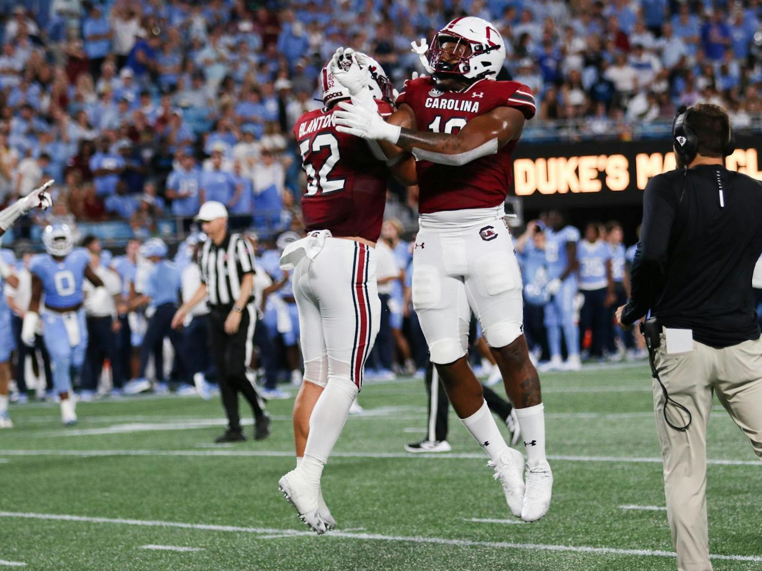 Sophomore linebacker Stone Blanton and graduate student edge Drew Tuazama celebrate after a successful defensive play. The Gamecocks fell to the Tar Heels 31-17 on Sept. 2, 2023.